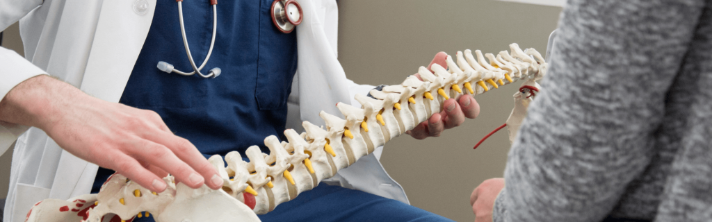 Chiropractor consults with a patient